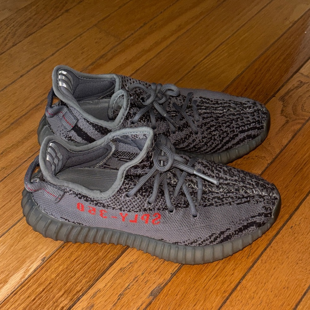 Yeezy Gray and Black Sneakers with Red Accents